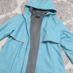 Light blue rain coat with zip up pockets